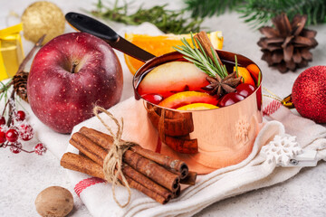 Hot mulled wine with fruits and spices. Autumn or winter warm drink