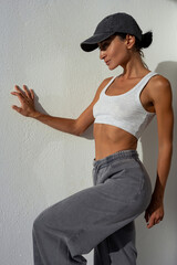 A beautiful and sexy woman against a white wall
