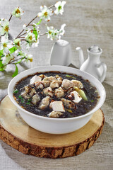 traditional chinese double boiled seafood hot soup seaweed egg oyster vegetable healthy in bowl on grey vintage background cafe hotel luxury halal food restaurant banquet menu