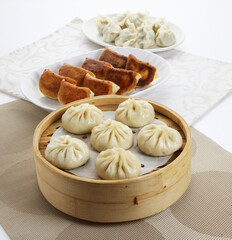 traditional chinese set Xiao long bao meat dumpling dim sum and soup snack vegetable in plate on grey vintage background cafe hotel luxury halal food restaurant banquet menu