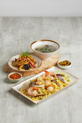 traditional chinese set seafood fried egg rice with dumpling dim sum tofu and soup snack vegetable in plate on grey vintage background cafe hotel luxury halal food restaurant banquet menu