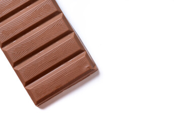 Traditional pieces of delicious Christmas chocolate nougat isolated on white background. Top view. Copy space