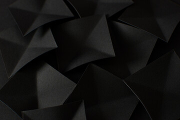 Abstract black background with black paper cut shapes