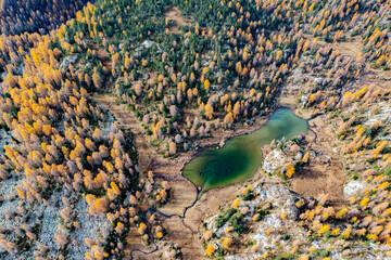 autumn aerial view of Mufulè lake in Valmalenco, Italy - 678097450