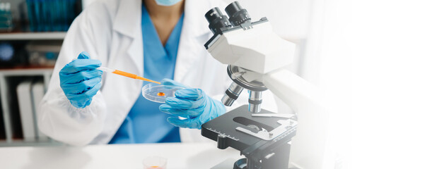 Scientist mixing chemical liquids in the chemistry lab. Researcher working in laboratory