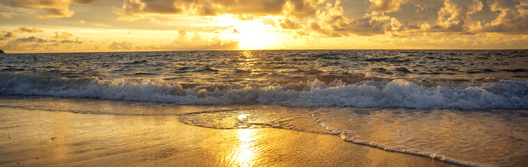 A beautiful wild beach, the waves of the clear sea roll on the white sand. evening sea.