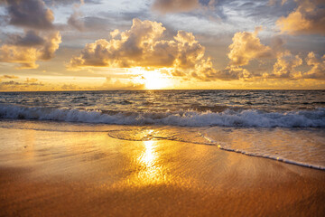 A beautiful wild beach, the waves of the clear sea roll on the white sand. evening sea.