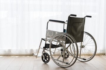 Fototapeta na wymiar Wheelchair in hospital room. hospital, health care, people and quarantine concept