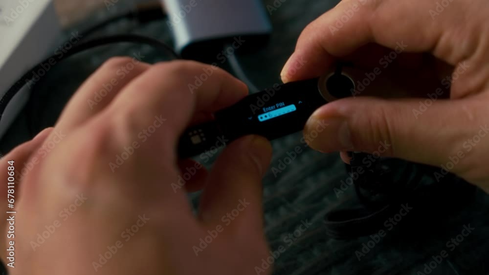 Poster man using hardware cryptocurrency wallet ledger. safe storage solution for bitcoin.