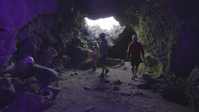 Speleologists Exploring Cave Entrance