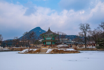 Snow falls in winter at Gyeongbokgung Palace, Seoul, South Korea.	