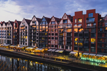 Old town in Gdansk at summer dusk Poland. Sunset night view from the window rooftop on new modern...