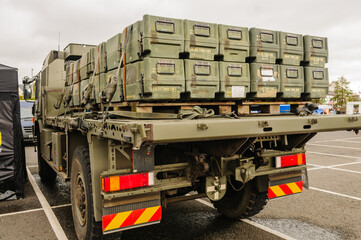 Boxes (inert) for anti-tank missiles on back of a flat-bed lorry.
