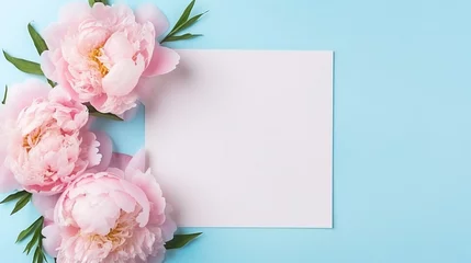 Poster Elegant feminine wedding or birthday flat lay composition with pink peonies floral bouquet. Blank paper card, mockup, invitations. Flat-lay, top view on  pale blue background. © PEPPERPOT