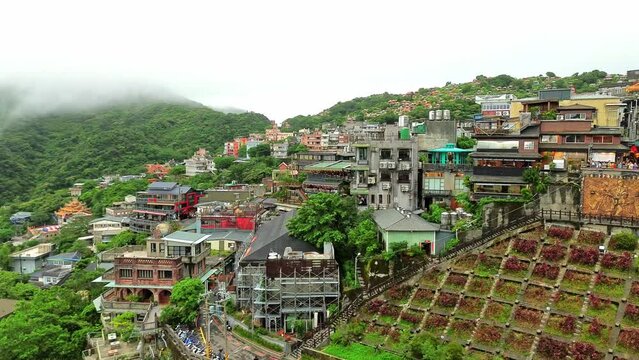 Aerial 4k footage of Jiufen Old Street during foggy weather. The so called Spirited Away of Taiwan with many tourist coming to travel.
