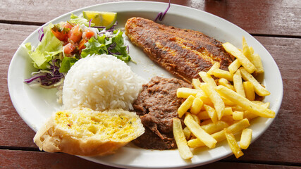 Costa Rican Grilled Fish Casado With Salad, Rice, Bread and French Fries 