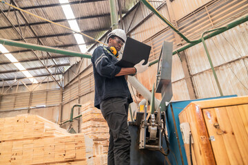 Wood mechanic inputs data, automates machines for cutting, laser, saw, milling, lathe in factory