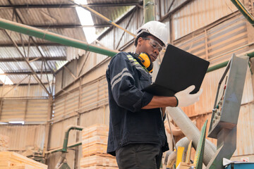 Wood mechanic inputs data, automates machines for cutting, laser, saw, milling, lathe in factory