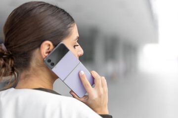 young business woman at the airport is using a smart phone