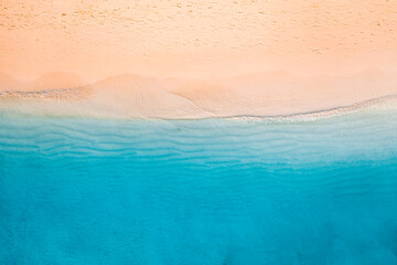 Relaxing aerial beach scene. Summer vacation holiday landscape banner. Waves surf crash amazing blue ocean lagoon, sea shore, coastline. Perfect aerial drone top view. Peaceful bright beach, seaside