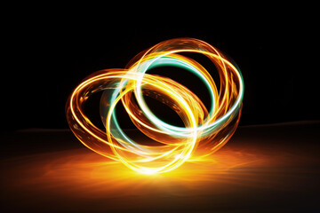 Long-exposure shot of illuminated poi spinning isolated on a white background 