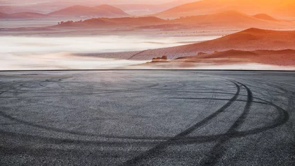 Wandcirkels tuinposter Asphalt road and mountain with fog natural landscape at sunrise © ABCDstock