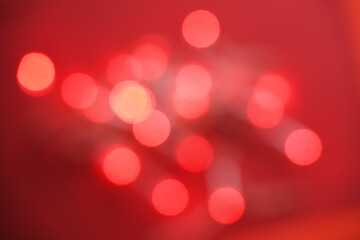 Red light bokeh for holiday lights background or Christmas background