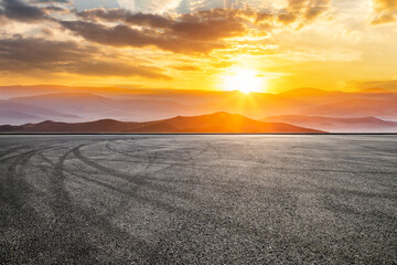 Asphalt road and mountain with sky clouds nature landscape at sunrise - obrazy, fototapety, plakaty