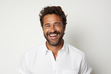 Portrait of a joyful man in his 40s wearing a simple cotton shirt against a white background. AI Generation