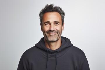 Portrait of a merry man in his 40s dressed in a comfy fleece pullover against a white background. AI Generation