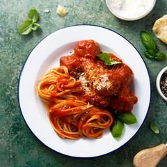 Spaghetti with meatballs and Parmesan cheese