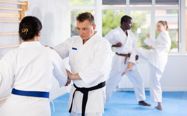 Multinational partners pupils are trained to perform defensive karate installations and attacking...