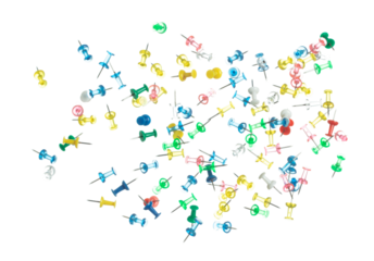 Push Pins in various color fly floating in mid air. Many group colour pins fall as office school stationary. Abstract pushpin explode unbox. White background isolated high speed shutter freeze motion