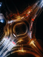 roundabout from above with car light streaks