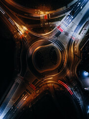 roundabout from above with car light streaks