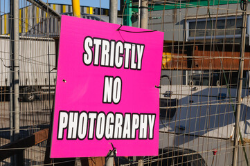 "Strictly no photography" sign on a fence outside a television and movie production studio.