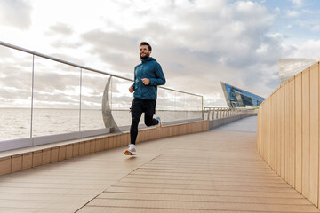 Runner trainer doing warm-up jogging. Healthy lifestyle physical education every day. A man...