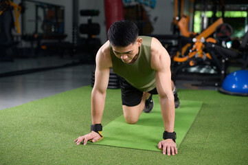 Asian man who keeps fit by doing push-ups Build strength in the chest muscles. Health workout...