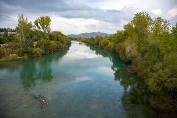 Fototapeta na wymiar Transparent waters of Kopru River (Köprüçay, ancient Eurymedon) with its emerald green colour in Koprulu Canyon (Köprülü Kanyon) National Park, Antalya, Turkey