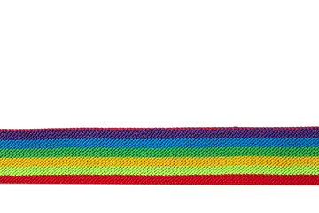 Colorful rainbow ribbon closeup isolated on white background. Colorful LGBT design. Curly, fluttering ribbon.