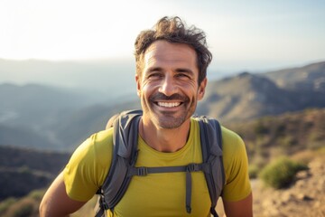 Portrait of a smiling man in his 40s sporting a breathable hiking shirt against a panoramic mountain vista. AI Generation
