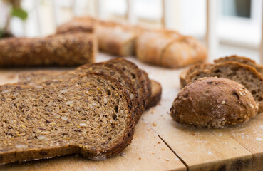 Fresh loaf of bread on wooden board