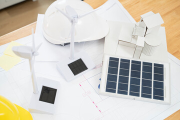 Solar panel and wind turbine model at office.