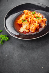 cauliflower tomato sauce casserole stewed vegetable healthy eating cooking appetizer meal food snack on the table copy space food background rustic top view 