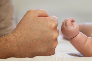 Dad's fist and kid's fist, hand size comparison