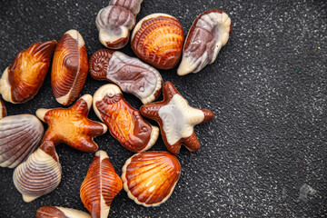 seashells candy chocolate sweet dessert eating meal food snack on the table copy space food background rustic top view
