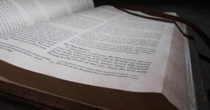 Bible macro slide over page text do not worry  Book of Matthew night atmosphere
