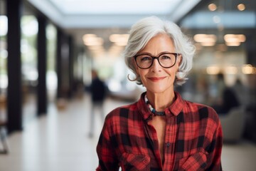 Portrait of a glad woman in her 70s wearing a comfy flannel shirt against a sophisticated corporate office background. AI Generation