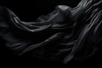 black fabric blowing on black background