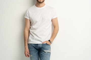 Shirt design and people concept - close up of young man in blank white t-shirt front view isolated